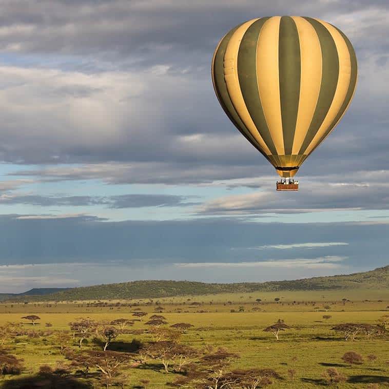 Enjoy endless views during a balloon safari in Serengeti